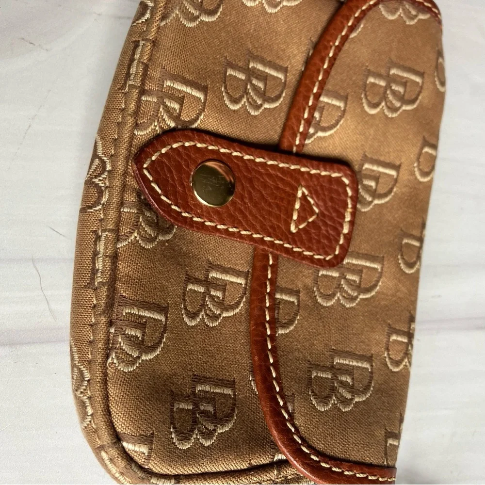 Dooney and Bourke signature logo tan leather and‎ brown monogram fabric wristlet